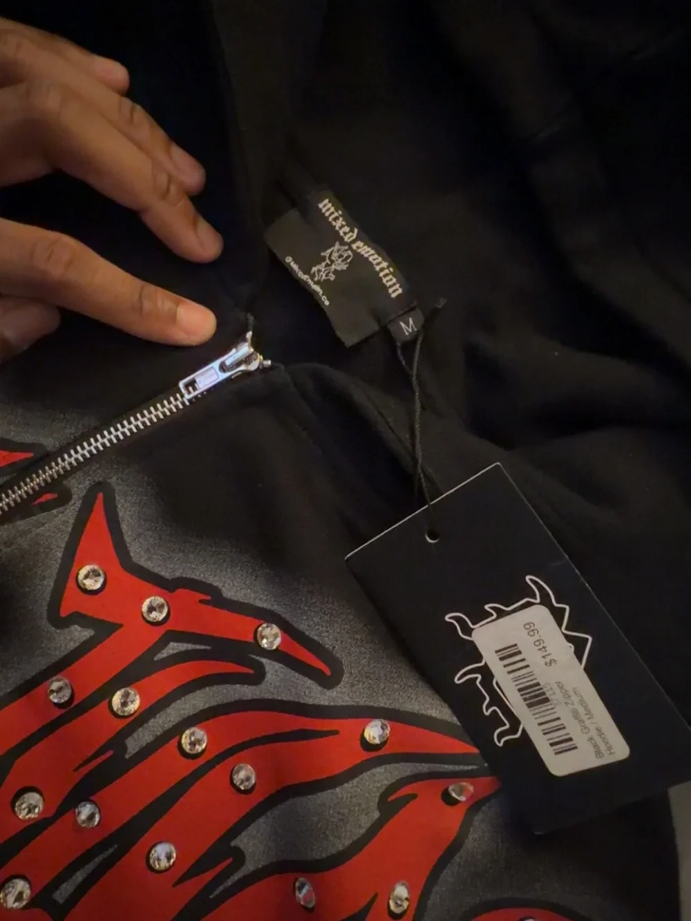 Mixed Emotions Black Zip-Up Hoodie with Red Studded Graphic